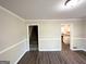 Open living room with modern flooring, staircase access, and a view into the kitchen, great for entertaining at 2361 Whites Mill Rd, Decatur, GA 30032