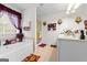 Bright bathroom features a tub with burgundy curtains and a glass enclosed shower at 3156 Oak Ridge Ln, Loganville, GA 30052