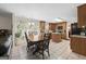 Open kitchen with wooden cabinetry, a center island, and a tile floor dining area at 3156 Oak Ridge Ln, Loganville, GA 30052