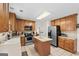 Spacious kitchen featuring wooden cabinets, stainless steel appliances, and a functional center island at 3156 Oak Ridge Ln, Loganville, GA 30052