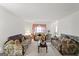 Cozy carpeted living room featuring matching floral sofas and bright lighting at 3156 Oak Ridge Ln, Loganville, GA 30052