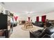 Spacious living room features a brick fireplace, plush seating, and a decorative ceiling fan at 3156 Oak Ridge Ln, Loganville, GA 30052