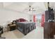 Spacious main bedroom with a tray ceiling, ceiling fan and lots of natural light at 3156 Oak Ridge Ln, Loganville, GA 30052