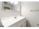 Bright bathroom featuring vanity with white cabinetry, mirror, and modern faucet at 5082 Highland Hills Ct # 93, Stone Mountain, GA 30088