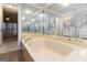Bathroom featuring a soaking tub, double vanity with mirrors, and tile flooring at 5082 Highland Hills Ct # 93, Stone Mountain, GA 30088