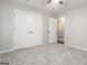 A well-lit bedroom has neutral walls and carpet with a spacious closet at 5082 Highland Hills Ct # 93, Stone Mountain, GA 30088