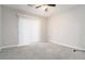 This bedroom offers natural light and plenty of space, with a simple sliding glass window at 5082 Highland Hills Ct # 93, Stone Mountain, GA 30088