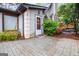 Inviting home entrance with a charming white door, decorative columns, and beautiful surrounding plants at 5082 Highland Hills Ct # 93, Stone Mountain, GA 30088