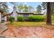 Home exterior with mature landscaping, a chimney, and potential for outdoor enjoyment and curb appeal at 5082 Highland Hills Ct # 93, Stone Mountain, GA 30088