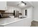 Kitchen with white cabinets, stainless steel appliances, and tile backsplash at 5082 Highland Hills Ct # 93, Stone Mountain, GA 30088