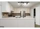 Kitchen with white cabinets, stainless steel appliances, and tile backsplash at 5082 Highland Hills Ct # 93, Stone Mountain, GA 30088