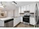 Updated kitchen with stainless appliances, updated countertops, tile backsplash at 5082 Highland Hills Ct # 93, Stone Mountain, GA 30088