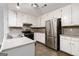 Eat-in kitchen featuring stainless steel appliances, and stylish countertop at 5082 Highland Hills Ct # 93, Stone Mountain, GA 30088