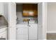Laundry area with washer, dryer, and built-in cabinets for extra storage space at 5082 Highland Hills Ct # 93, Stone Mountain, GA 30088
