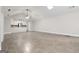 Spacious living room with tile floors, a vaulted ceiling, and a view into the bright, modern kitchen at 5082 Highland Hills Ct # 93, Stone Mountain, GA 30088