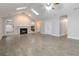 Spacious living room with a cozy fireplace, skylights, vaulted ceiling, and stylish tile flooring at 5082 Highland Hills Ct # 93, Stone Mountain, GA 30088