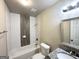 Bright bathroom featuring tiled tub with modern fixtures and granite countertop at 3191 Gay Dr, Decatur, GA 30032