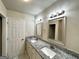 Bathroom with double vanity and granite counters at 3191 Gay Dr, Decatur, GA 30032