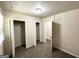 Bedroom with neutral walls, carpeted floor, closet doors, and a view into the hallway at 3191 Gay Dr, Decatur, GA 30032
