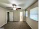 Neutral bedroom featuring two windows and door to the bathroom at 3191 Gay Dr, Decatur, GA 30032