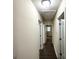 Hallway featuring hardwood floors and neutral walls leading to multiple bedrooms at 3191 Gay Dr, Decatur, GA 30032