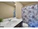 Bathroom showcasing vanity with solid surface countertop and shower with decorative curtain at 157 Oliver Dr, Locust Grove, GA 30248