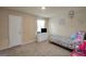 Comfortable bedroom with a twin bed, a white dresser and lots of free space for activities at 157 Oliver Dr, Locust Grove, GA 30248