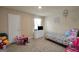 Bright bedroom with a twin bed, and a play area, perfect for creative activities at 157 Oliver Dr, Locust Grove, GA 30248