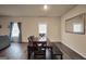 Bright dining area with hardwood floors and a classic wooden table set at 157 Oliver Dr, Locust Grove, GA 30248