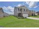 Stylish two-story home with a well-maintained lawn and attached two car garage at 157 Oliver Dr, Locust Grove, GA 30248