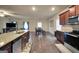 Open-concept kitchen flowing into the dining and living areas, featuring granite counters at 157 Oliver Dr, Locust Grove, GA 30248
