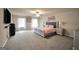 Large main bedroom with a ceiling fan and a comfortable, stylish king-sized bed at 157 Oliver Dr, Locust Grove, GA 30248