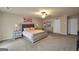 A spacious main bedroom with a plush king-sized bed, dresser, and ample carpeted area at 157 Oliver Dr, Locust Grove, GA 30248