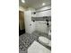 Updated bathroom with a walk-in shower, unique tiling, and accessibility features at 1093 Grace Sw St, Mableton, GA 30126