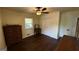 Comfortable bedroom featuring hardwood floors, ceiling fan, and dresser at 1093 Grace Sw St, Mableton, GA 30126