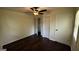 Cozy bedroom featuring a ceiling fan, wood floors, and a closet at 1093 Grace Sw St, Mableton, GA 30126