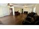 Spacious living room featuring hardwood floors, ceiling fans, and multiple seating arrangements at 1093 Grace Sw St, Mableton, GA 30126