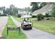 Enjoy golf cart access on this tree-lined cart path leading to nearby homes in the neighborhood at 110 S Fairfield Dr, Peachtree City, GA 30269