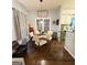 Well-lit dining area with seating for four and an open view into the kitchen at 110 S Fairfield Dr, Peachtree City, GA 30269
