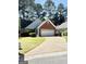 Charming single-Gathering home with brick accents and a well-maintained front lawn at 110 S Fairfield Dr, Peachtree City, GA 30269