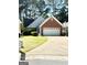 Charming single-Gathering home with brick accents and a well-maintained front lawn at 110 S Fairfield Dr, Peachtree City, GA 30269