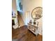 Inviting foyer with hardwood floors, staircase, fireplace, and decorative mirror at 110 S Fairfield Dr, Peachtree City, GA 30269