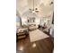 The spacious living room is filled with natural light, creating a bright and inviting atmosphere for relaxation and entertainment at 110 S Fairfield Dr, Peachtree City, GA 30269