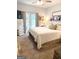 Well-lit main bedroom featuring neutral tones, ensuite access, and a calming ambiance at 110 S Fairfield Dr, Peachtree City, GA 30269