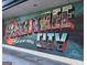 Colorful Peachtree City mural with vintage Georgia-themed artwork on a building exterior at 110 S Fairfield Dr, Peachtree City, GA 30269