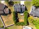The aerial view highlights the home's roof, backyard with a distinctive hedge, and the layout of the property at 2554 Willenhall Way, Lithonia, GA 30058