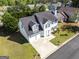 Aerial view of a two-story home showcasing its well-kept lawn and neighborhood at 2554 Willenhall Way, Lithonia, GA 30058