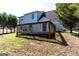 Large backyard with well-maintained lawn and spacious deck at 2554 Willenhall Way, Lithonia, GA 30058
