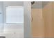 Bathroom highlights soaking tub next to window and a shower with peach colored walls at 2554 Willenhall Way, Lithonia, GA 30058