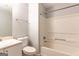 Standard bathroom with a shower-tub combo and white fixtures at 2554 Willenhall Way, Lithonia, GA 30058